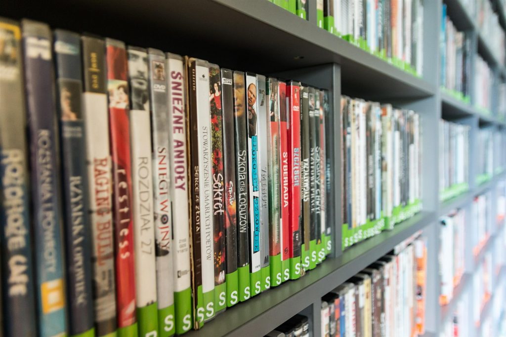 Movie and book shelf at a library